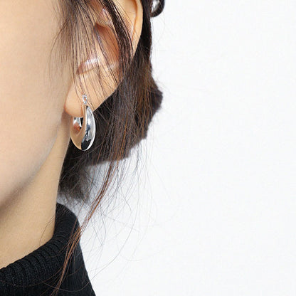 Rounded U Hoop Earrings in 925 sterling silver. Full rounded U curves bring a sculptural finish to everyday hoops.