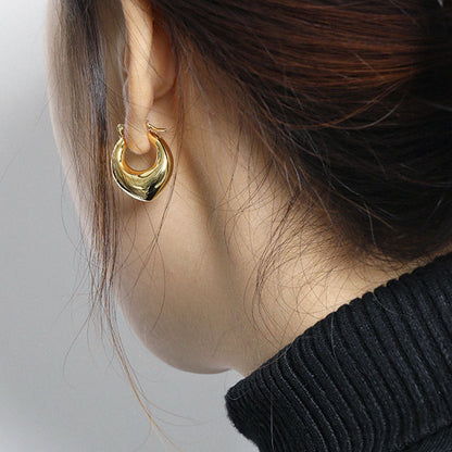 Rounded U Hoop Earrings in 925 sterling silver. Full rounded U curves bring a sculptural finish to everyday hoops.