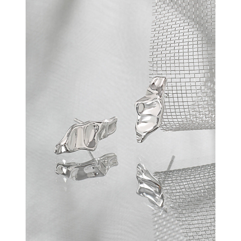 Sculpted Pod Stud Earrings in 925 sterling silver. Polished pod shapes with gently uneven, organic contours.
