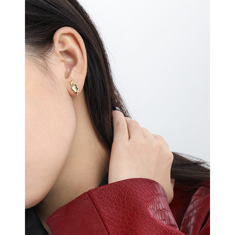 Sculpted Pod Stud Earrings in 925 sterling silver. Polished pod shapes with gently uneven, organic contours.