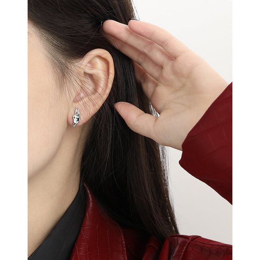 Sculpted Pod Stud Earrings in 925 sterling silver. Polished pod shapes with gently uneven, organic contours.