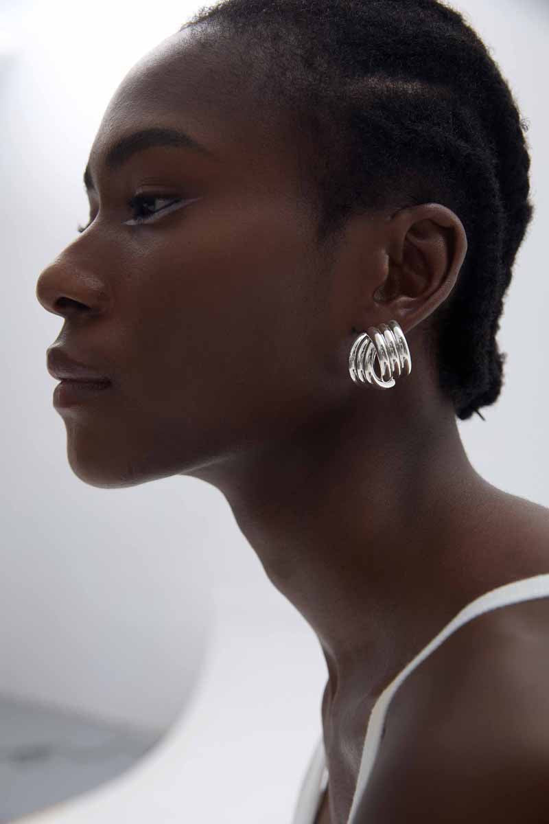 Sculptural Cross Stud Earrings in 999 fine silver. Rounded intersecting forms create a bold sculptural cross.