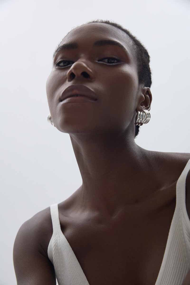 Sculptural Cross Stud Earrings in 999 fine silver. Rounded intersecting forms create a bold sculptural cross.