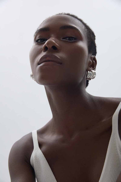 Sculptural Cross Stud Earrings in 999 fine silver. Rounded intersecting forms create a bold sculptural cross.