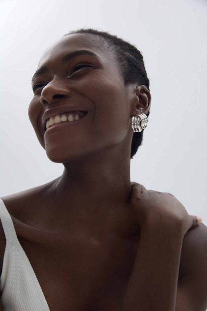 Sculptural Cross Stud Earrings in 999 fine silver. Rounded intersecting forms create a bold sculptural cross.