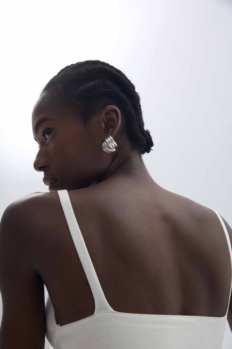 Sculptural Cross Stud Earrings in 999 fine silver. Rounded intersecting forms create a bold sculptural cross.