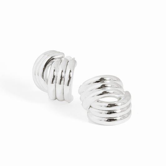 Sculptural Cross Stud Earrings in 999 fine silver. Rounded intersecting forms create a bold sculptural cross.