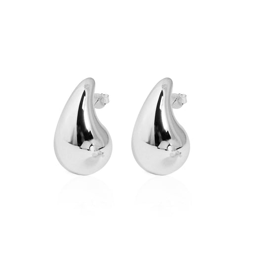 Sculptural Teardrop Stud Earrings in 999 fine silver. Rounded teardrop studs with smooth, reflective curves.