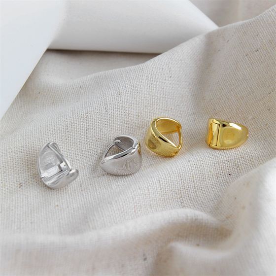 Soft Triangle Hoop Earrings in 925 sterling silver. Rounded triangular curves give petite hoops a geometric twist.
