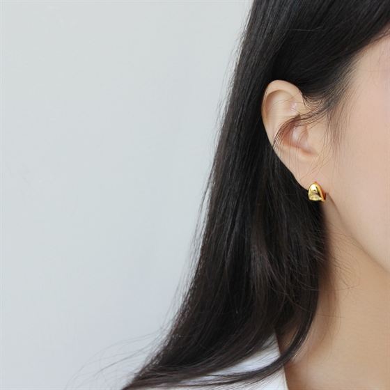 Soft Triangle Hoop Earrings in 925 sterling silver. Rounded triangular curves give petite hoops a geometric twist.
