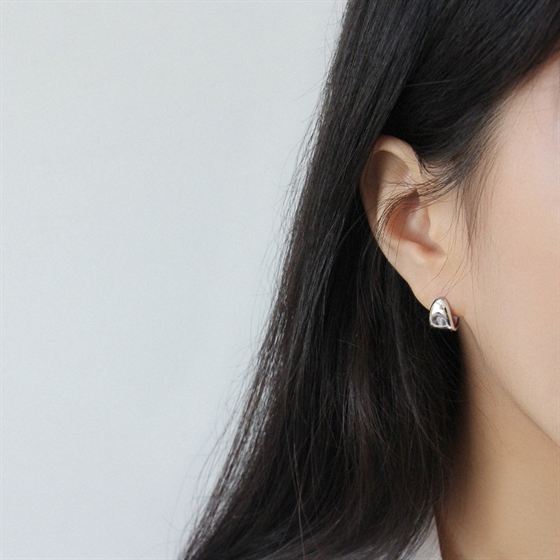 Soft Triangle Hoop Earrings in 925 sterling silver. Rounded triangular curves give petite hoops a geometric twist.