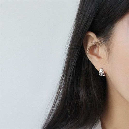 Soft Triangle Hoop Earrings in 925 sterling silver. Rounded triangular curves give petite hoops a geometric twist.