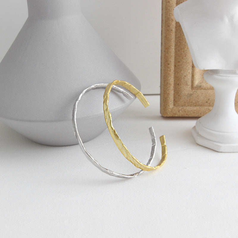 Textured Open Cuff Bangle in 925 sterling silver. An open cuff with an uneven surface that catches the light.