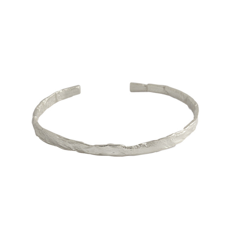 Textured Open Cuff Bangle in 925 sterling silver. An open cuff with an uneven surface that catches the light.