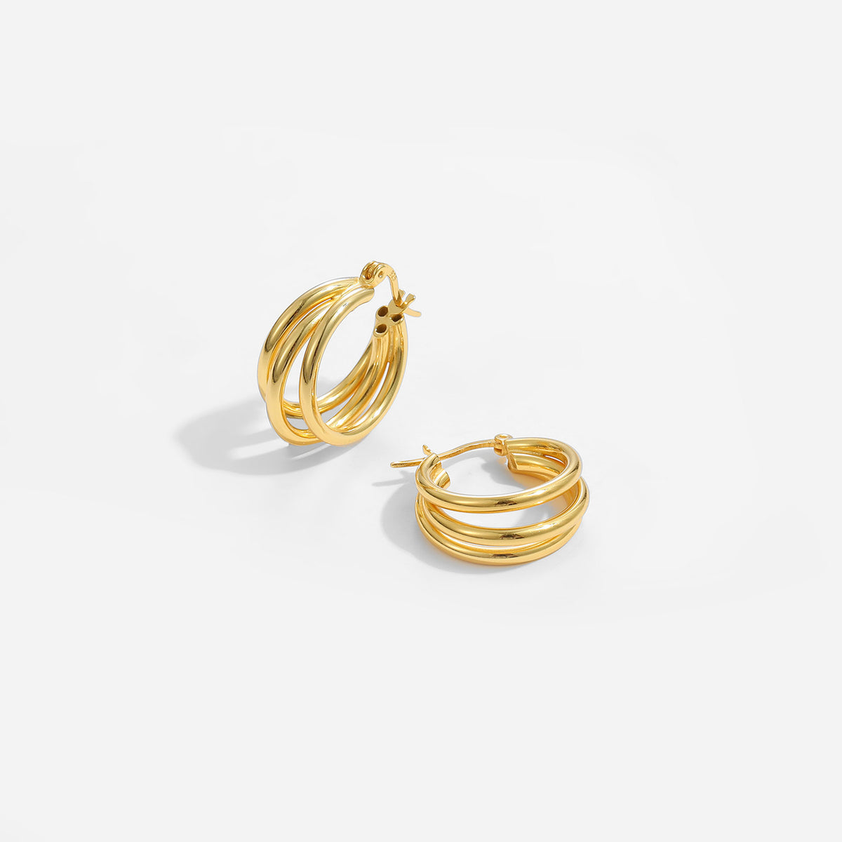 Triple Row Hoop Earrings in 925 sterling silver. Three open rows create a layered hoop with a polished finish.