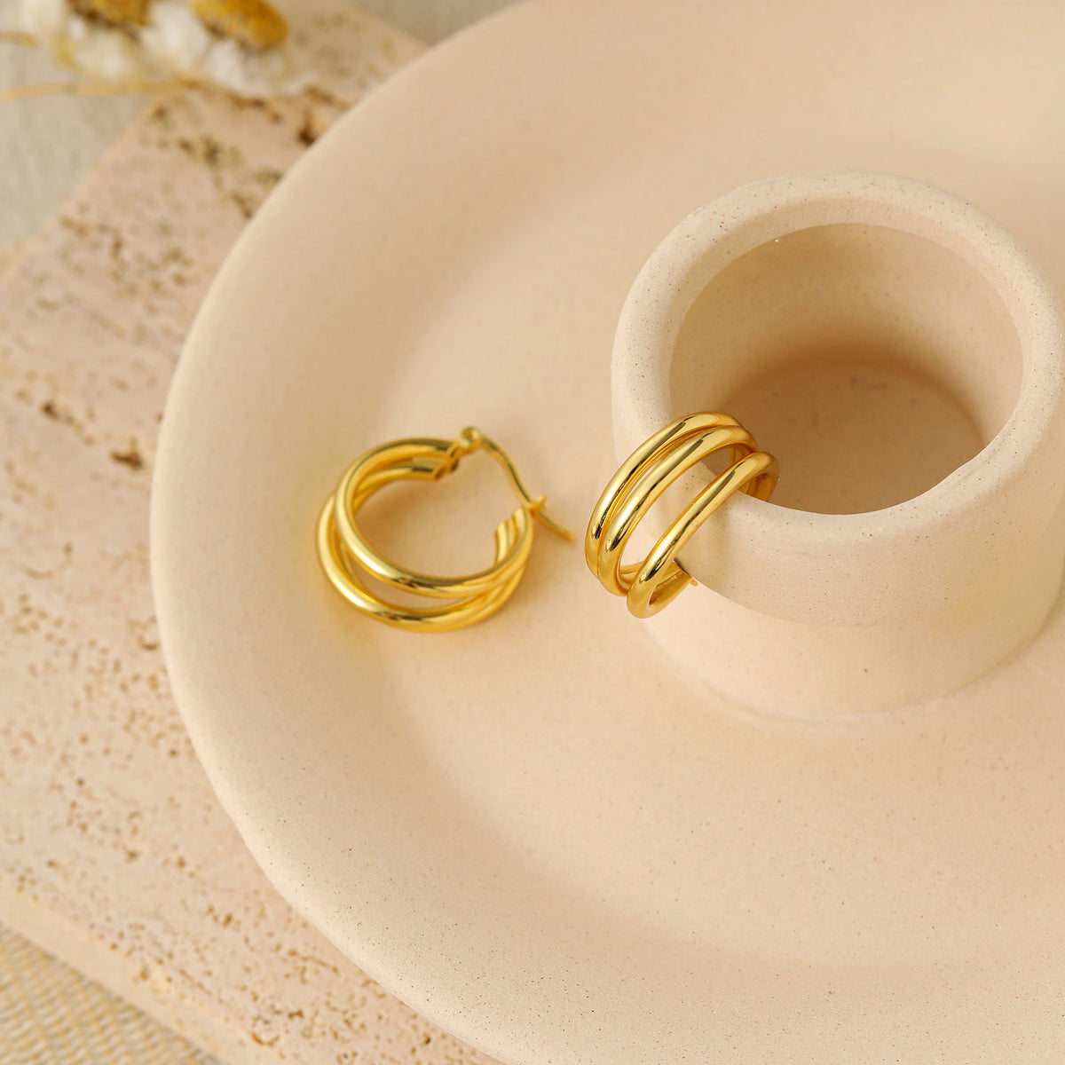 Triple Row Hoop Earrings in 925 sterling silver. Three open rows create a layered hoop with a polished finish.