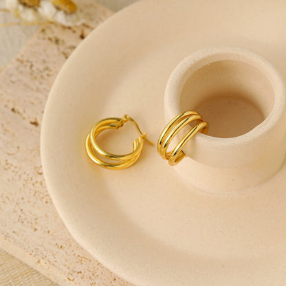 Triple Row Hoop Earrings in 925 sterling silver. Three open rows create a layered hoop with a polished finish.