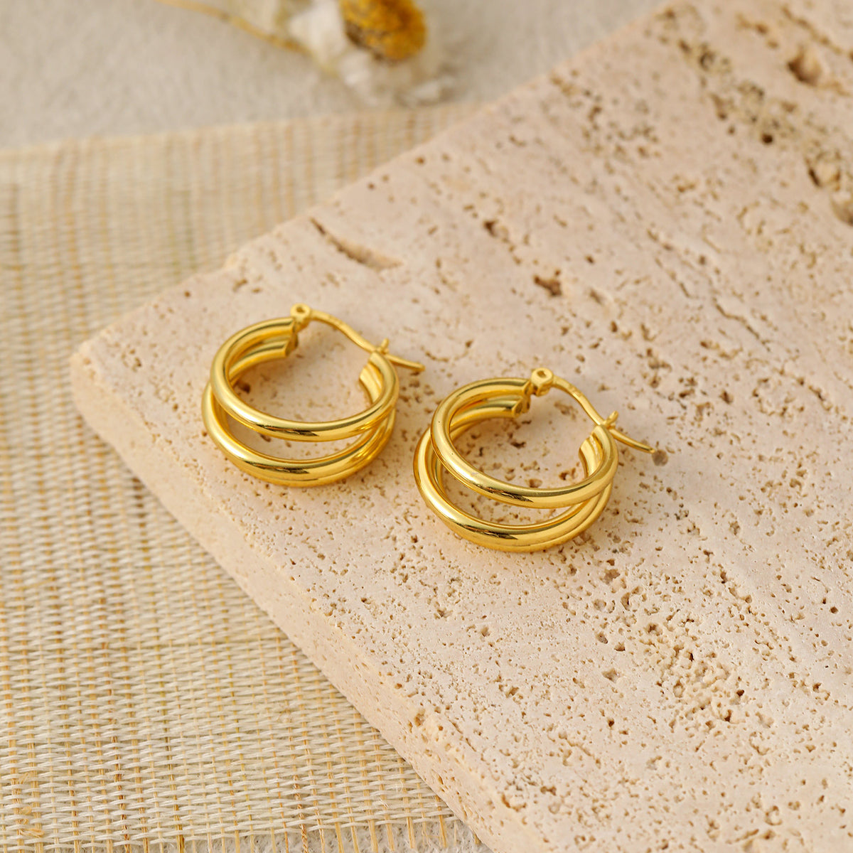 Triple Row Hoop Earrings in 925 sterling silver. Three open rows create a layered hoop with a polished finish.