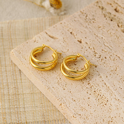 Triple Row Hoop Earrings in 925 sterling silver. Three open rows create a layered hoop with a polished finish.