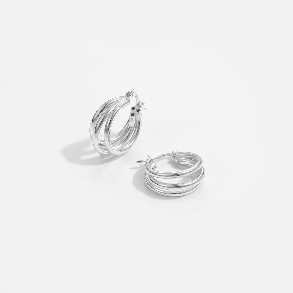 Triple Row Hoop Earrings in 925 sterling silver. Three open rows create a layered hoop with a polished finish.