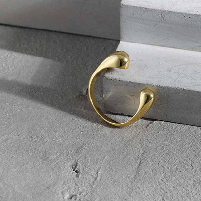 Twin Teardrop Open Ring in 925 sterling silver. Two rounded teardrop ends curve towards each other in an open band.