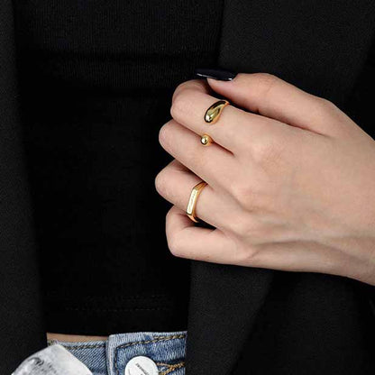 Twin Teardrop Open Ring in 925 sterling silver. Two rounded teardrop ends curve towards each other in an open band.
