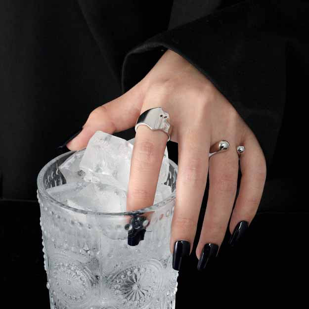 Twin Teardrop Open Ring in 925 sterling silver. Two rounded teardrop ends curve towards each other in an open band.