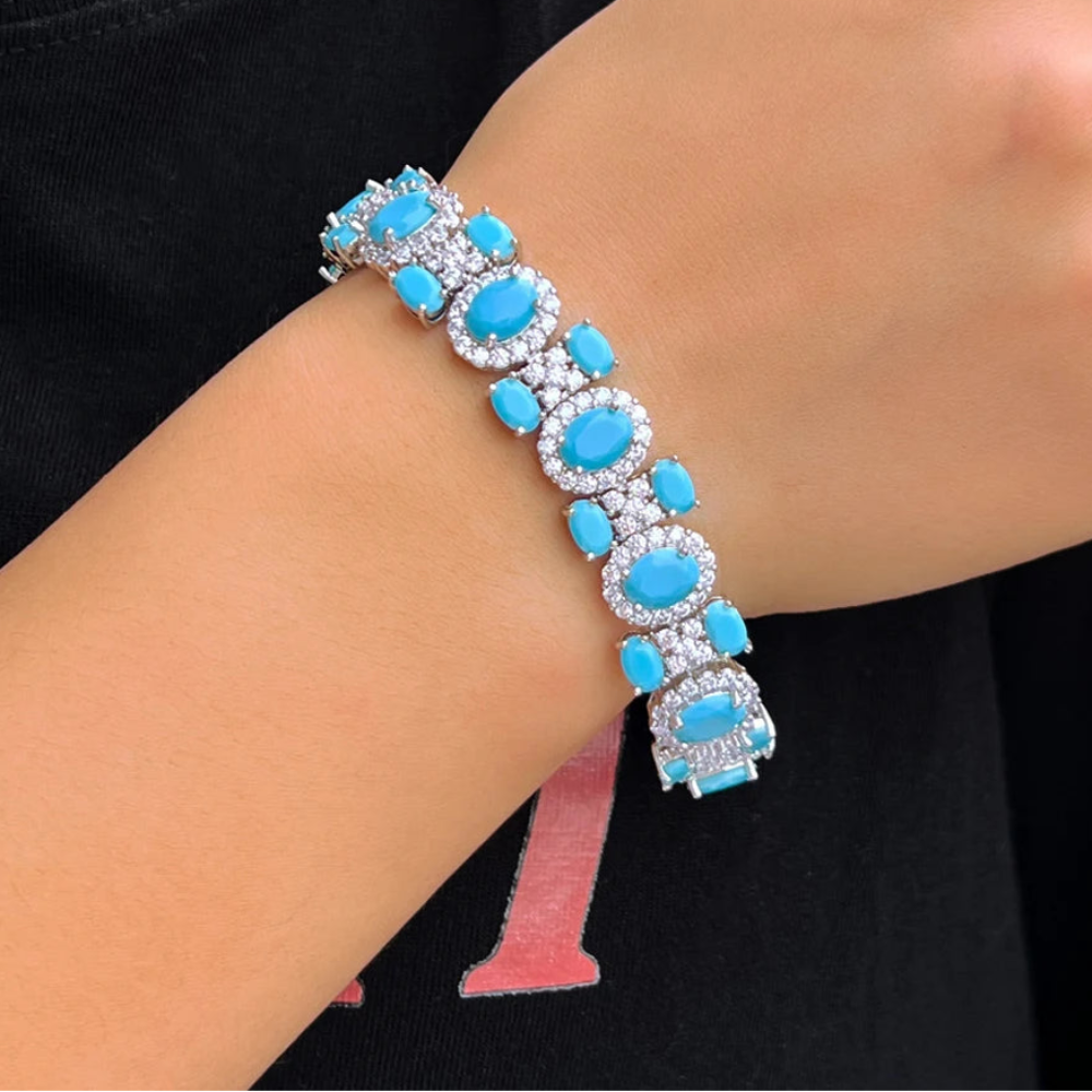 Silver tone turquoise oval CZ bracelet with turquoise blue and clear cubic zirconia stones