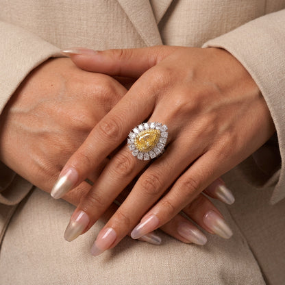 Pale yellow pear teardrop halo statement silver ring worn on hand - Ratnali Jewels