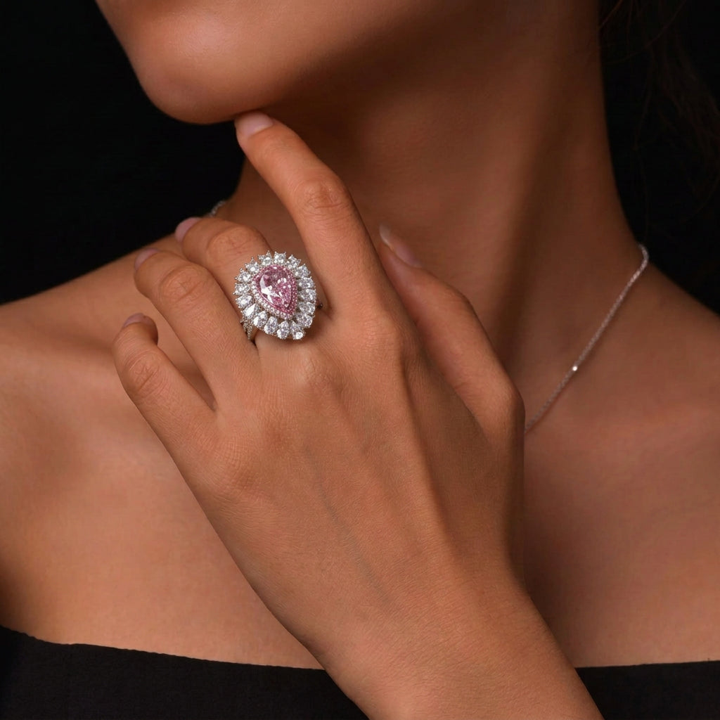 Pink pear teardrop halo statement silver ring worn on hand - Ratnali Jewels