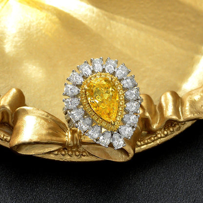 Pale yellow pear teardrop halo statement silver ring, angled view - Ratnali Jewels