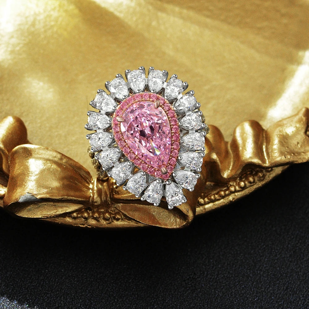 Pink pear teardrop halo statement silver ring, angled view - Ratnali Jewels