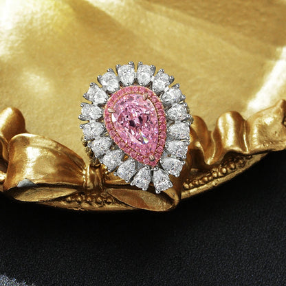 Pink pear teardrop halo statement silver ring, angled view - Ratnali Jewels