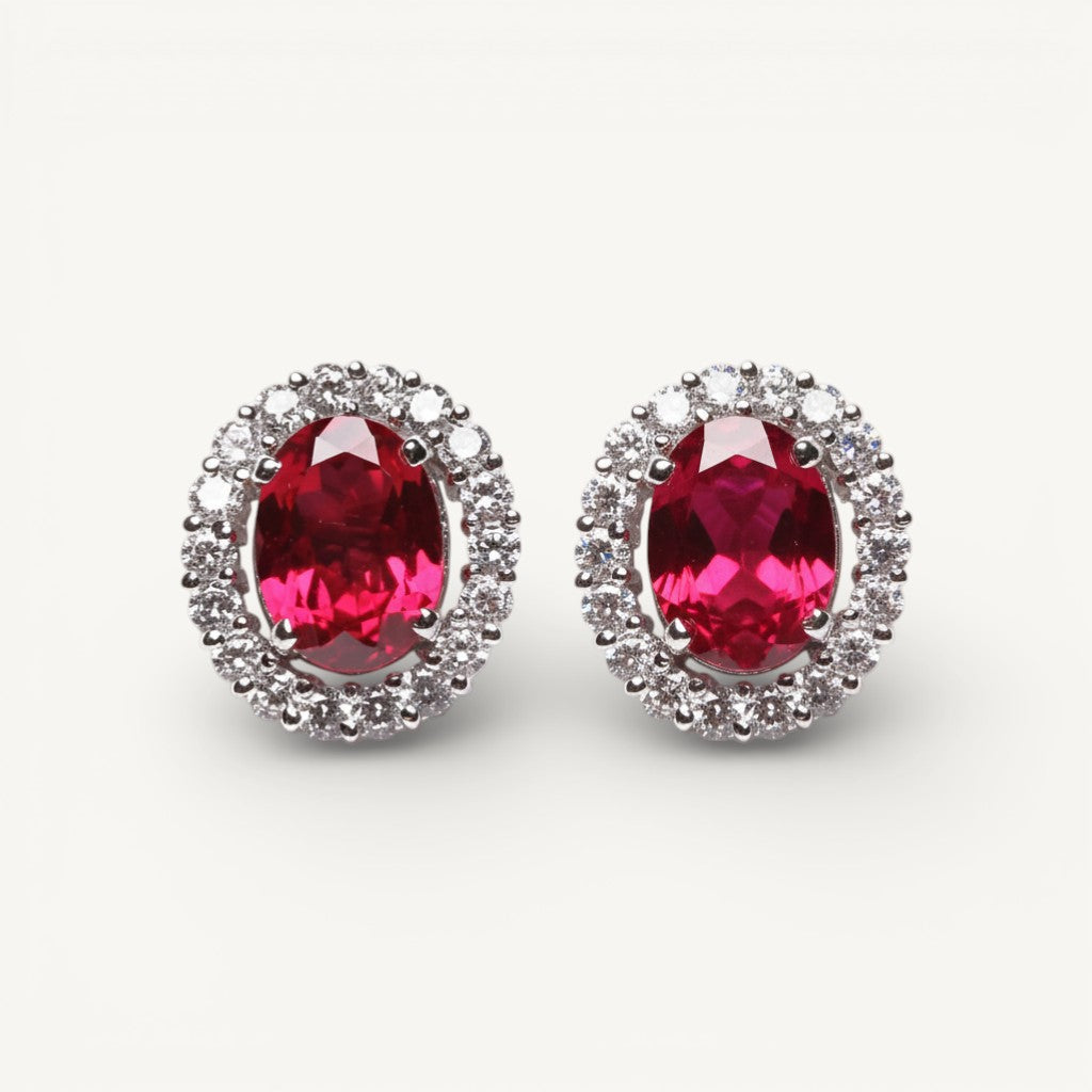 Ruby gemstone stud earrings with diamonds around the stone